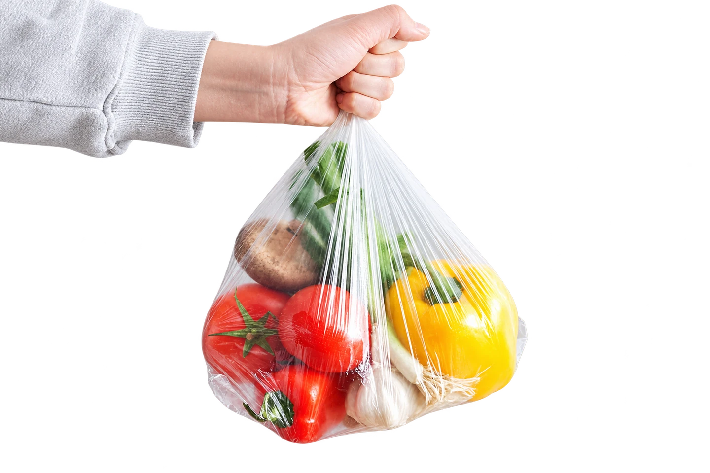 Clear produce bag holding assorted vegetables