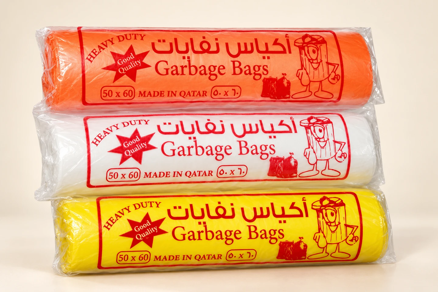 Orange, white and yellow garbage-bag rolls in printed sleeves