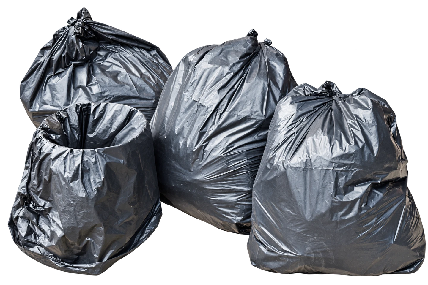 Four filled black garbage bags with tied tops