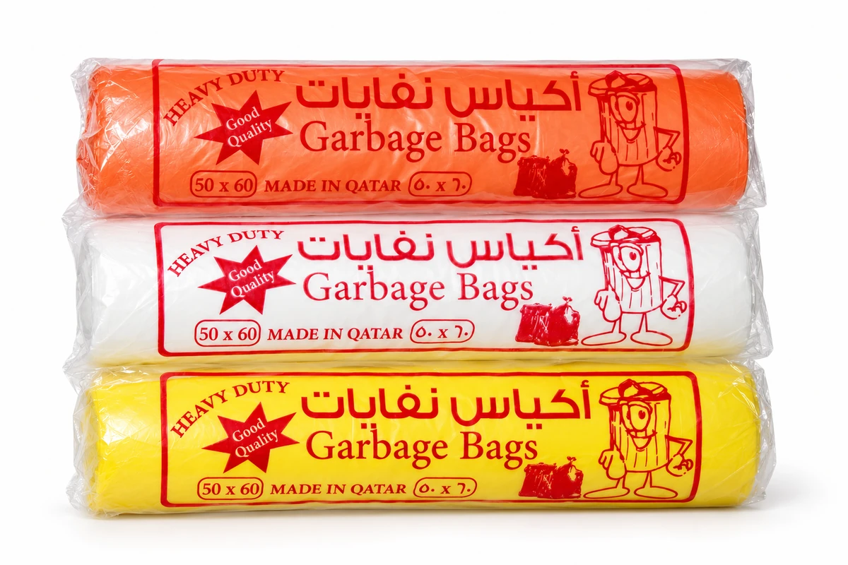 Three packaged garbage-bag rolls in orange, white and yellow
