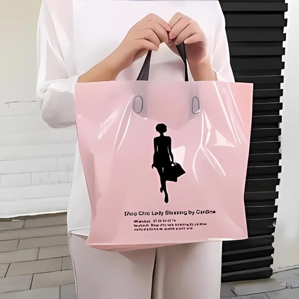 Pink printed shopping bag with black loop handles
