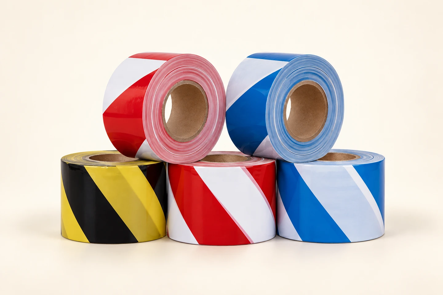Red and white, blue and white, and black and yellow warning-tape rolls